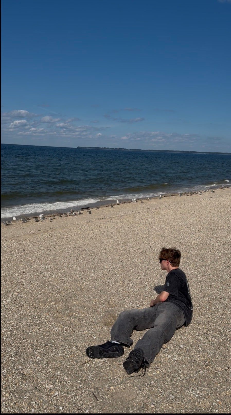 BeyondCure beach campaign seated at the shoreline