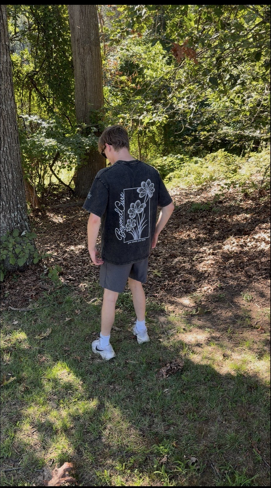 BeyondCure golf campaign in the woods showing the back graphic